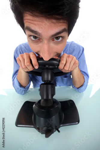 Photo: Man pretending to play a console Man pretending to play a console