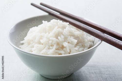Photo: Long grain rice bowl with chopsticks Long grain rice bowl with chopsticks