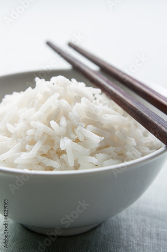 Photo: Long grain rice bowl with chopsticks Long grain rice bowl with chopsticks