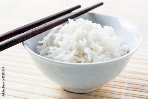Photo: Long grain rice bowl with chopsticks Long grain rice bowl with chopsticks