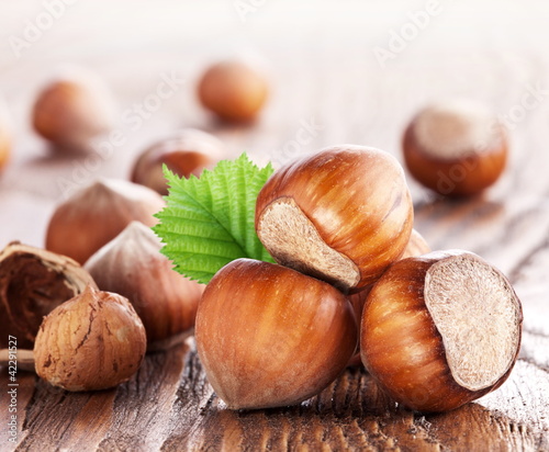Photo: Filberts on a wooden table. Close-up shot. Filberts on a wooden table. Close-up shot.