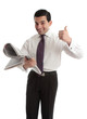 Businessman stockbroker with newspaper thumbs up