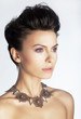 Portrait of sexy young woman with precious necklace closeup