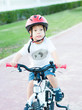 A boy on a bicycle on a background of nature