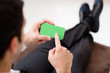 Photo: Businessman using smartphone with green screen for web and e-mai Businessman using smartphone with green screen for web and e-mai