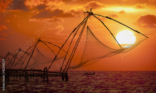 Photo: Sunset over Chinese Fishing nets in Cochin Sunset over Chinese Fishing nets in Cochin