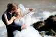 young beautiful pair of newlyweds on the sea