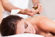 Beautiful young woman getting back massage