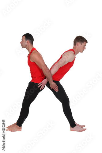 Photo: Two male gymnasts Two male gymnasts