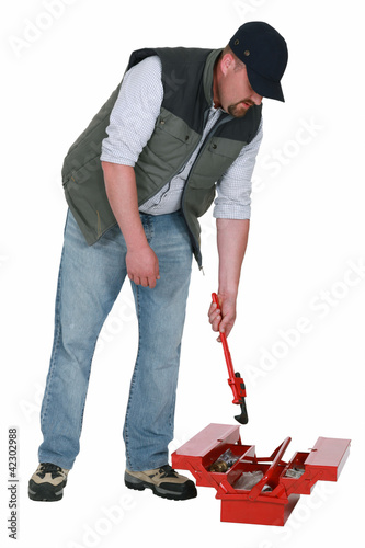 Photo: Worker getting a wrench out of a toolbox Worker getting a wrench out of a toolbox