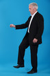 Businessman stepping on an insect