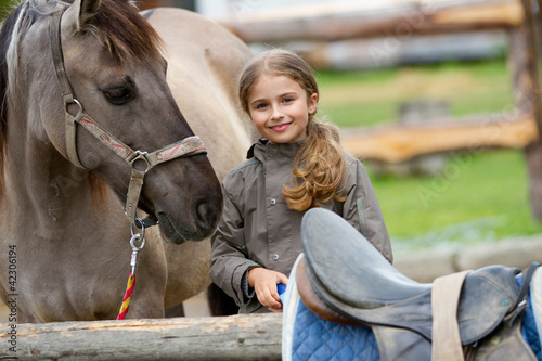 Photo: Horse and lovely girl on a ranch Horse and lovely girl on a ranch