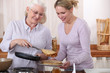 Elderly woman and daughter with pancakes