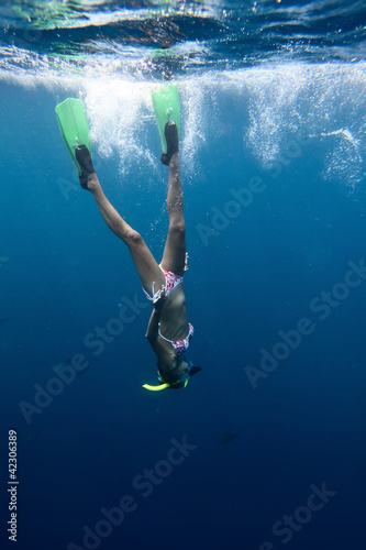 Photo: Young woman diving Young woman diving