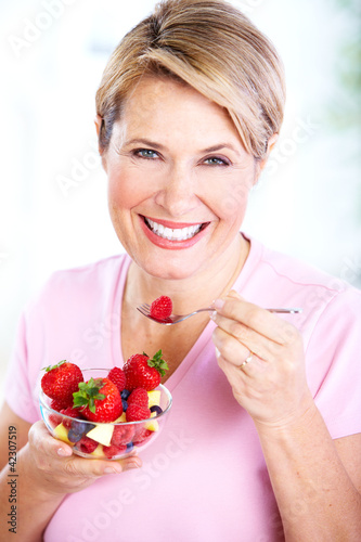 Photo: Senior woman with a salad. Diet. Senior woman with a salad. Diet.