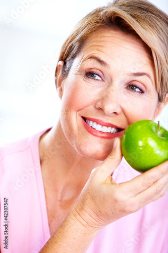 Photo: Senior woman with apple. Diet. Senior woman with apple. Diet.
