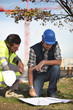 Construction workers discussing plans
