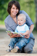 Photo: Mother with son reading a book Mother with son reading a book