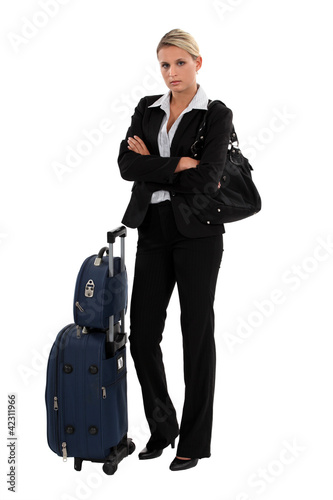 Photo: Blond businesswoman with luggage Blond businesswoman with luggage