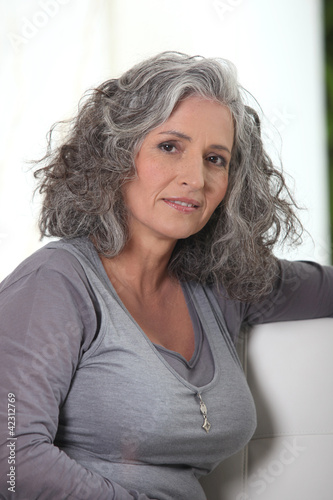 Foto: Grey-haired retired woman has a lot of free time Grey-haired retired woman has a lot of free time
