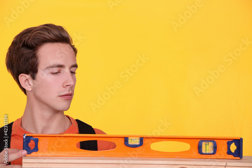 Photo: Craftsman with spirit-level Craftsman with spirit-level
