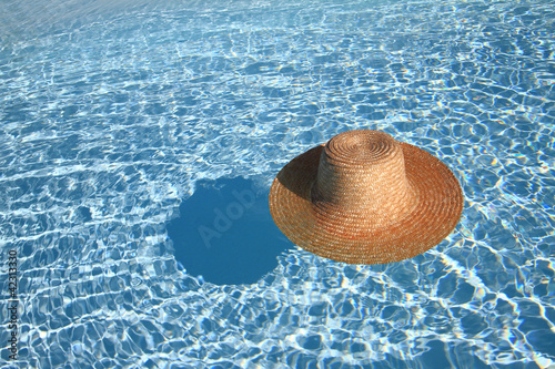 Photo: Straw hat in the pool Straw hat in the pool