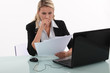 Young woman working in front of a laptop