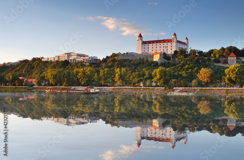 Photo: Bratislava castle with reflection in river Danube - Slovakia Bratislava castle with reflection in river Danube - Slovakia