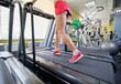 Close up of female legs on a treadmill