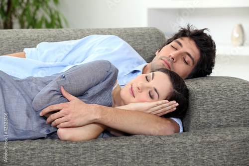 Photo: Couple asleep on sofa Couple asleep on sofa