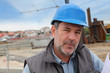 Portrait of entrepreneur on building site