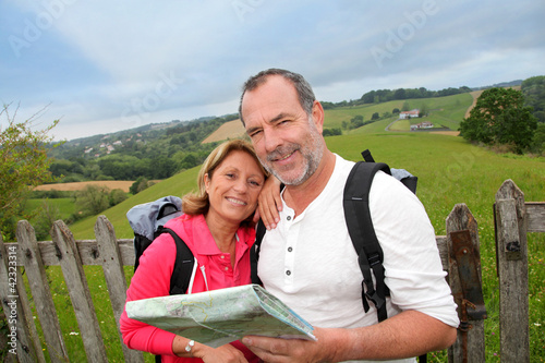 Photo: Retired people reading map on trekking day Retired people reading map on trekking day