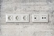 electric ethernet and antenna socket on concrete wall