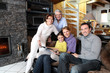 Photo: Family sitting in front of a fire Family sitting in front of a fire