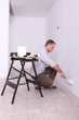 Man painting a wall