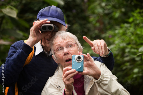 Photo: Couple Searching in Forest Couple Searching in Forest