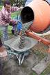Photo: Man with a cement mixer Man with a cement mixer