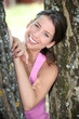 a sporty woman between two trees