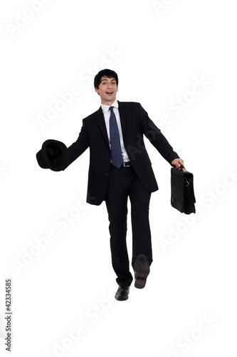 Foto: Man in a suit with briefcase and hat Man in a suit with briefcase and hat