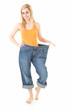 weight loss - proud of herself young woman in too great trousers