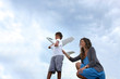 Mother and son playing with plane