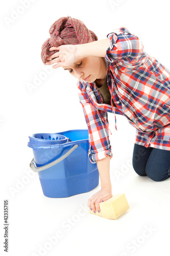 Photo: woman in casual shirt cleaning floor woman in casual shirt cleaning floor