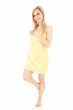 cheering young woman in yellow towel, full length
