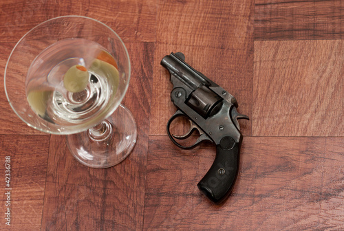 Photo: Cocktail and gun Cocktail and gun
