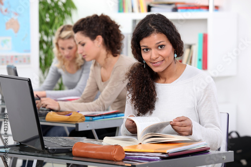 Photo: Adult student working at a laptop in a classroom Adult student working at a laptop in a classroom