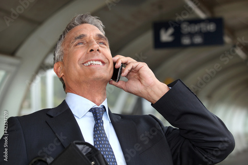 Photo: portrait of a businessman on the phone portrait of a businessman on the phone