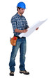 Tradesman examining a blueprint
