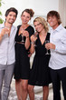 Two young couples drinking champagne