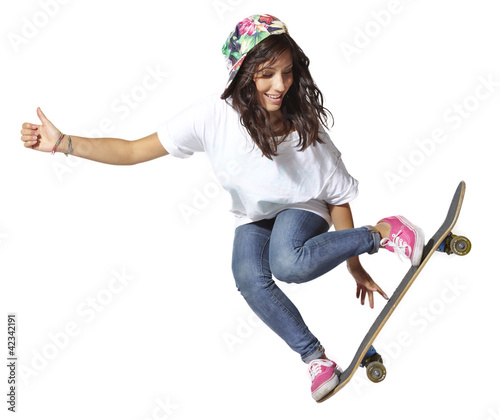 Photo: Skateboarder woman jumping isolated, showing thumbs up Skateboarder woman jumping isolated, showing thumbs up