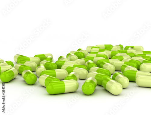 Illustration: Green pills on white background Green pills on white background